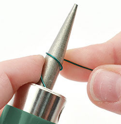 Wire being wrapped around mandrel